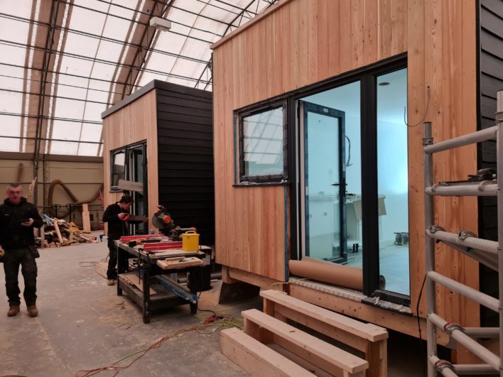 New Meaning Foundation staff in warehouse making modular homes